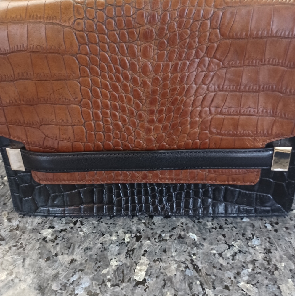 "Autograph" crocodile design clutch purse.